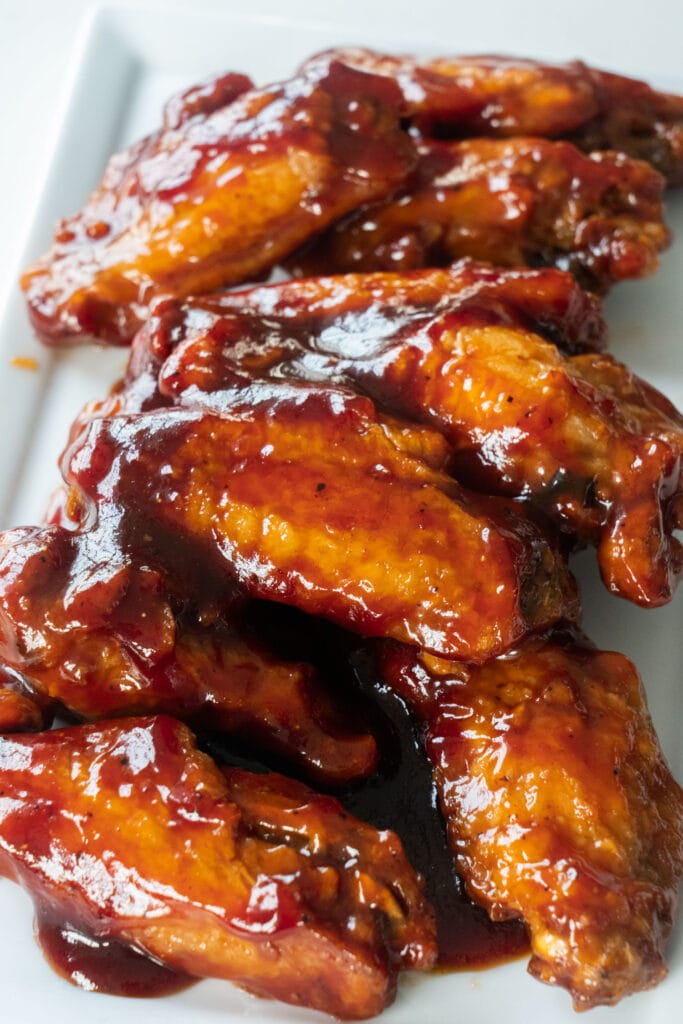 chicken wings with homemade bbq sauce on top.