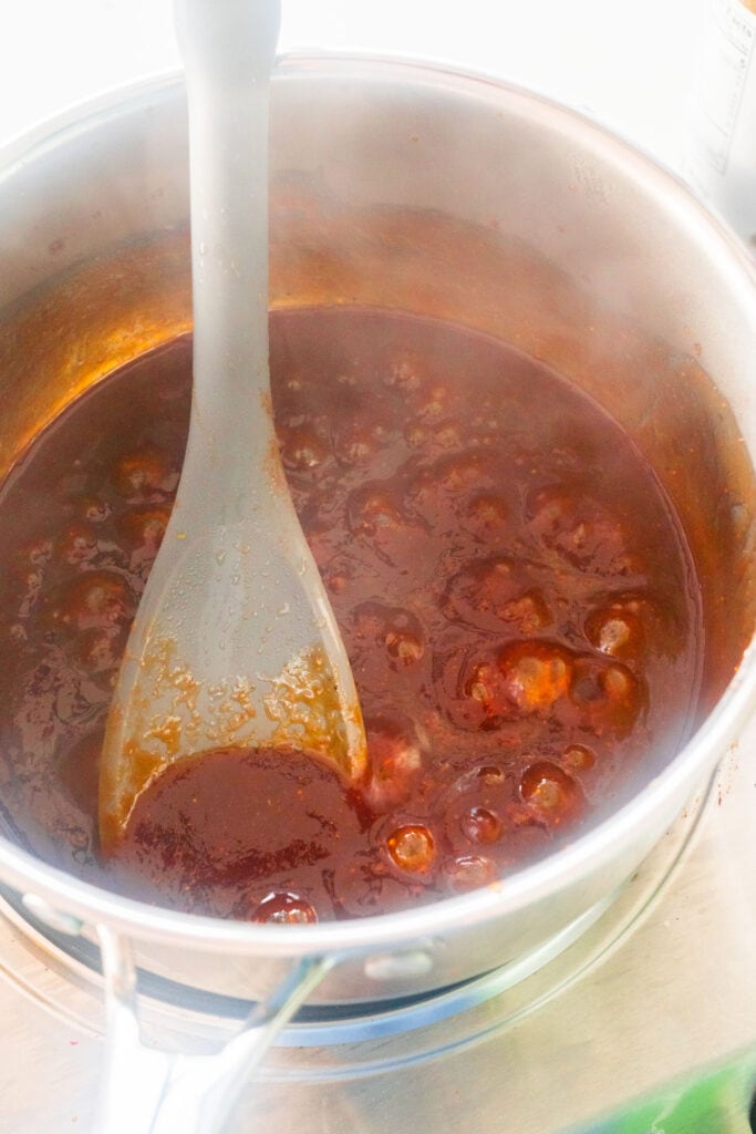 bbq sauce simmering in small saucepan.