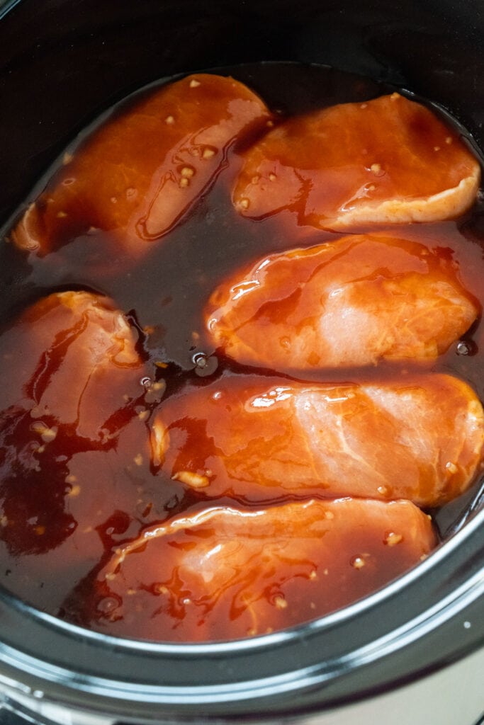 pork chops with sauce in slow cooker.