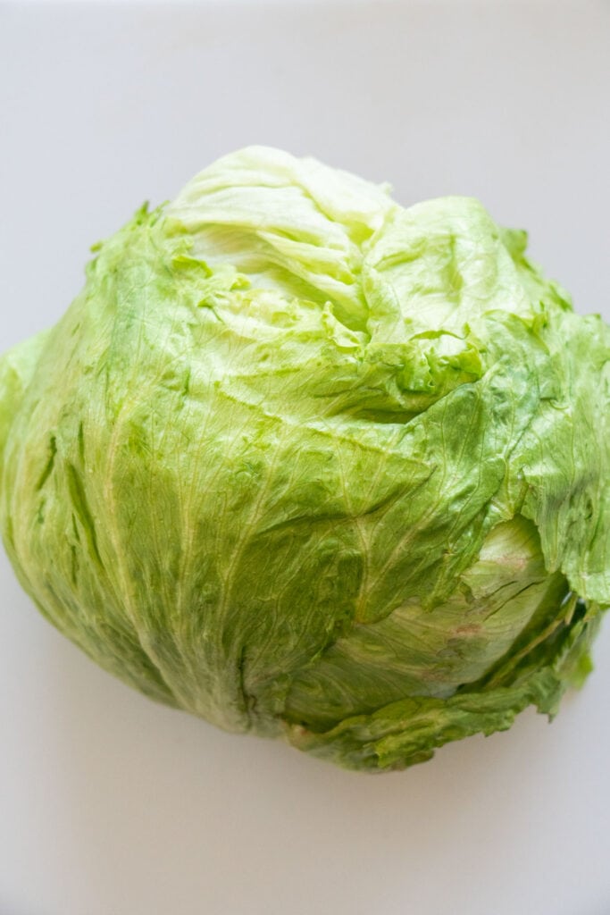 head of lettuce on table.