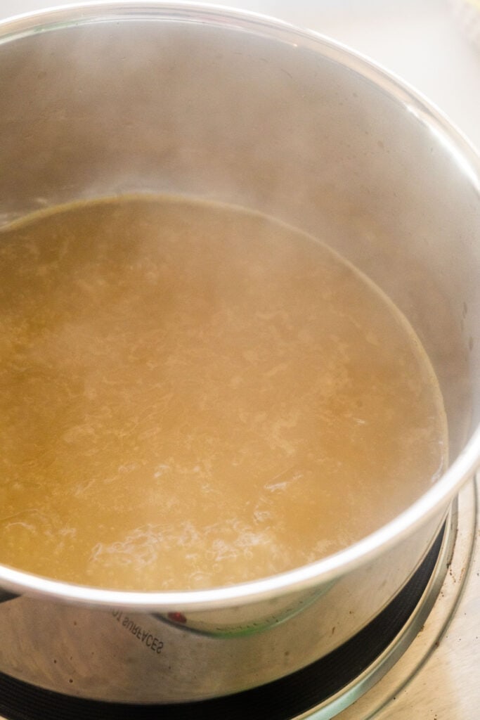 gravy simmering in saucepan.