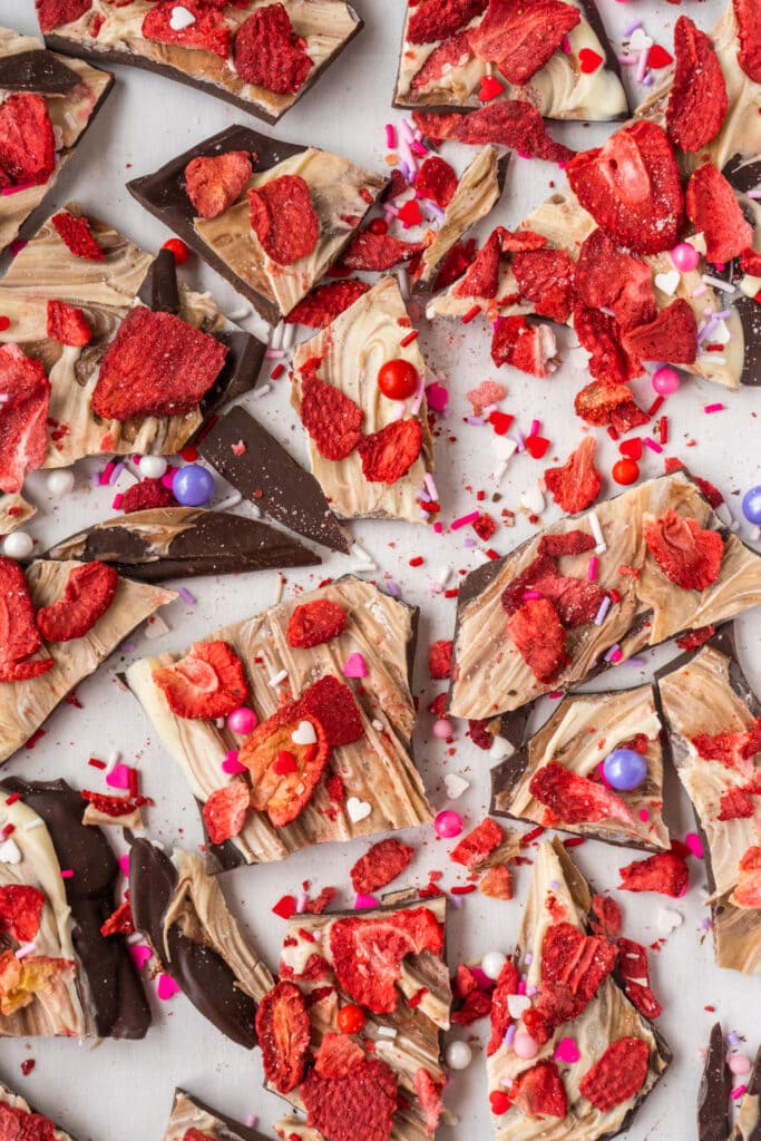 pieces of chocolate  bark on white table.