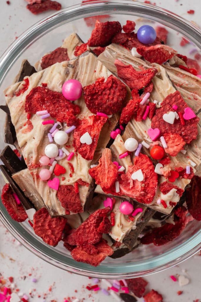glass bowl filled with strawberry chocolate bark.