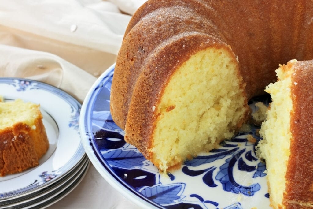 fluffy pound cake on blue and white serving plate.
