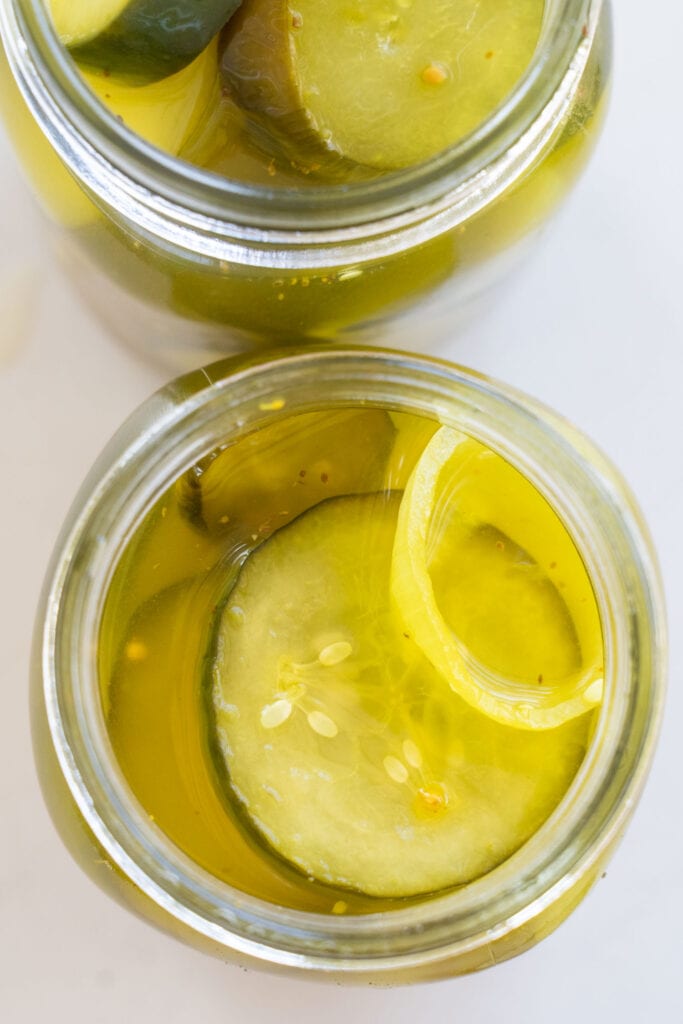 top down view of pickles in jars.