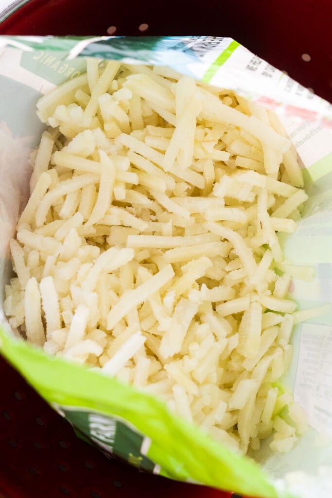 open bag of frozen hash browns.