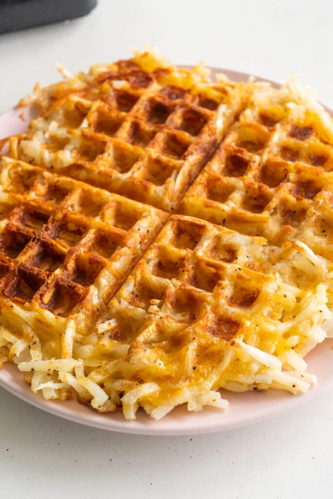 crispy cooked hash browns on plate.