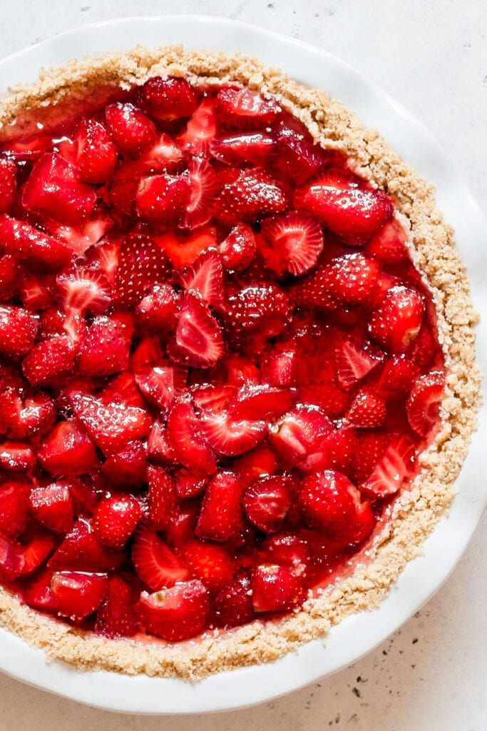 baked strawberry pie in pie crust, ready to be served.