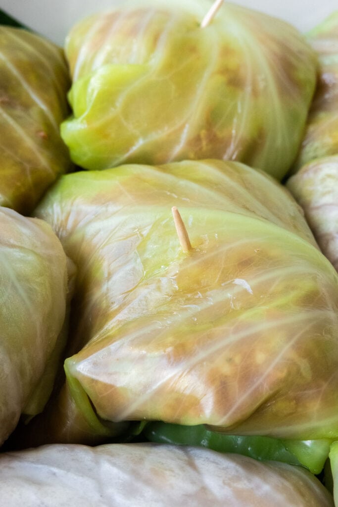 cabbage rolls rolled up with toothpicks in them.