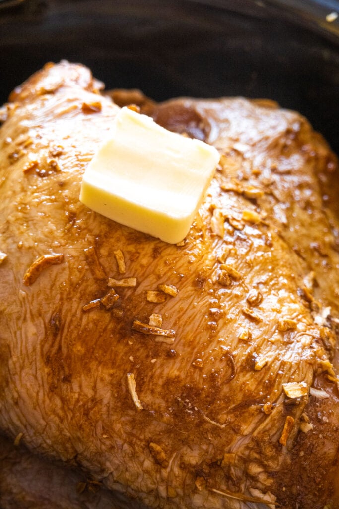 pat of butter on top of turkey breast.