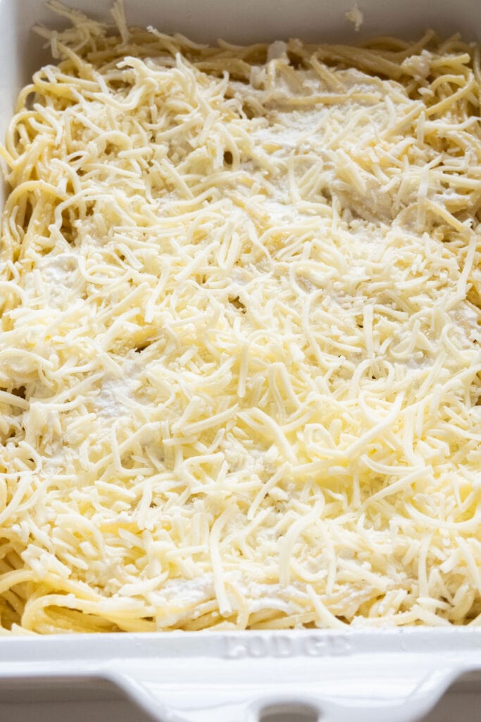 shredded cheese added to baking dish.
