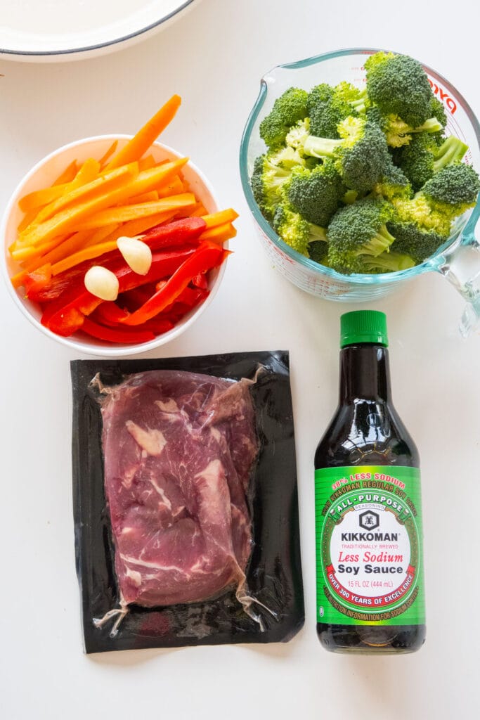 ingredients that you need to make beef and broccoli on table.