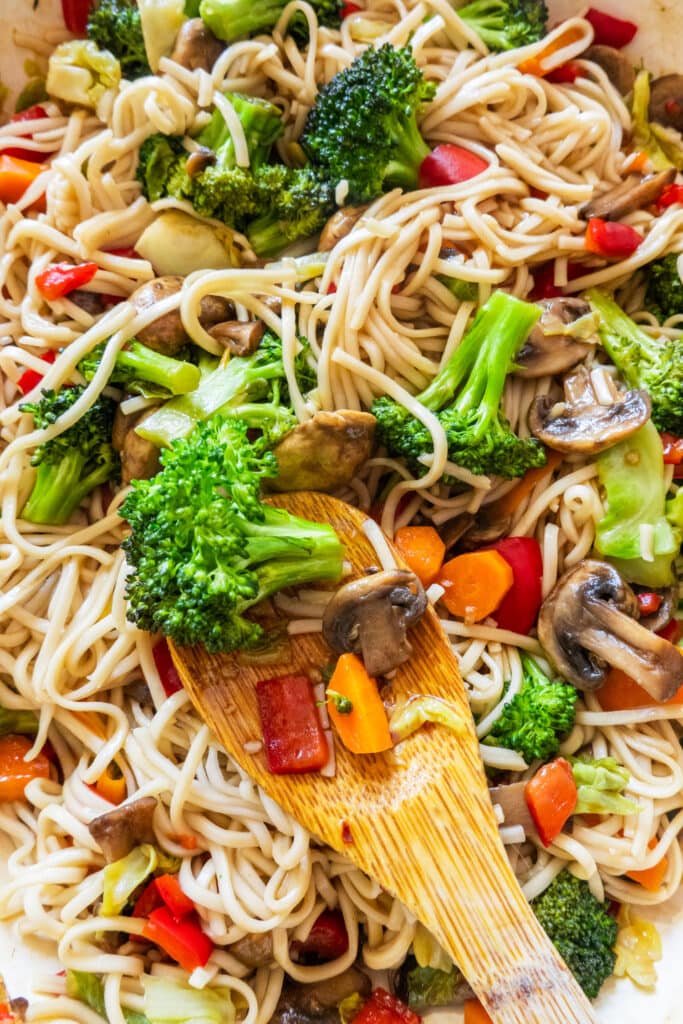 vegetable lo mein filled with veggies in skillet.