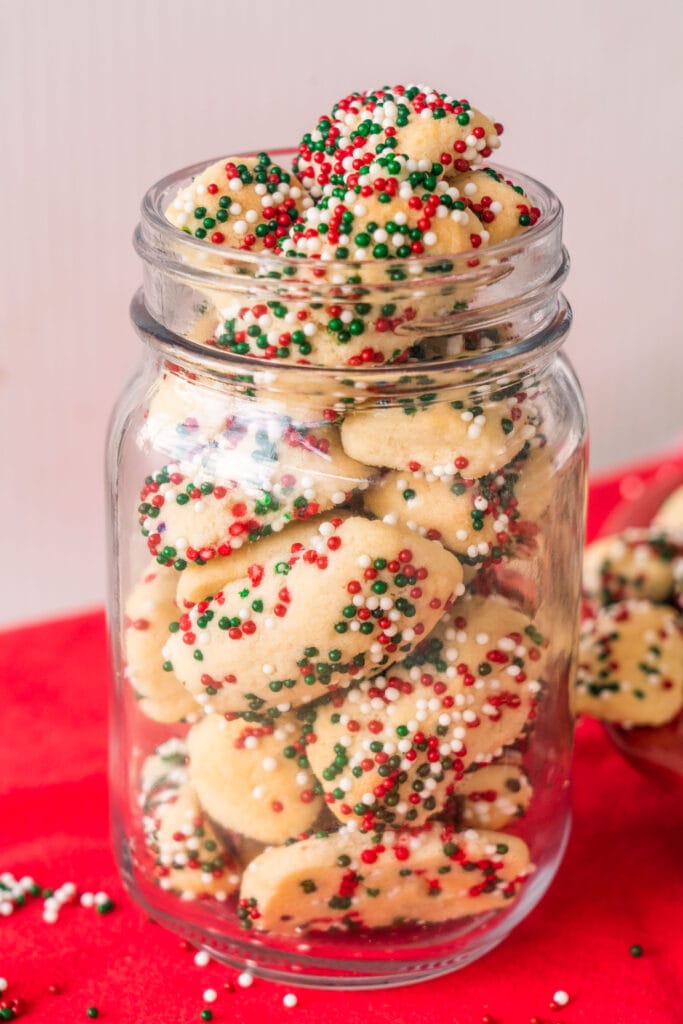 mason jar filled with small cookies for a gift.