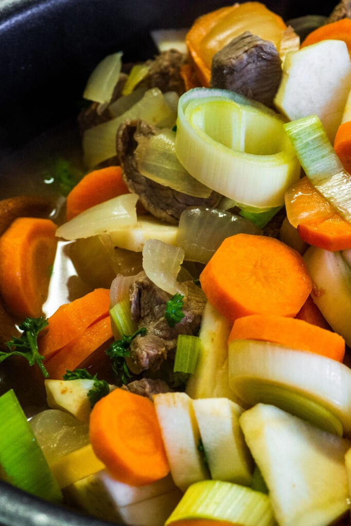 closeup of beef stew in slow cooker. 