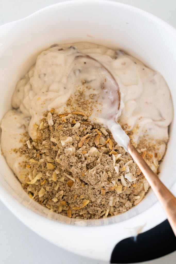 cream of mushroom soup mixture mixed in white bowl with spoon.