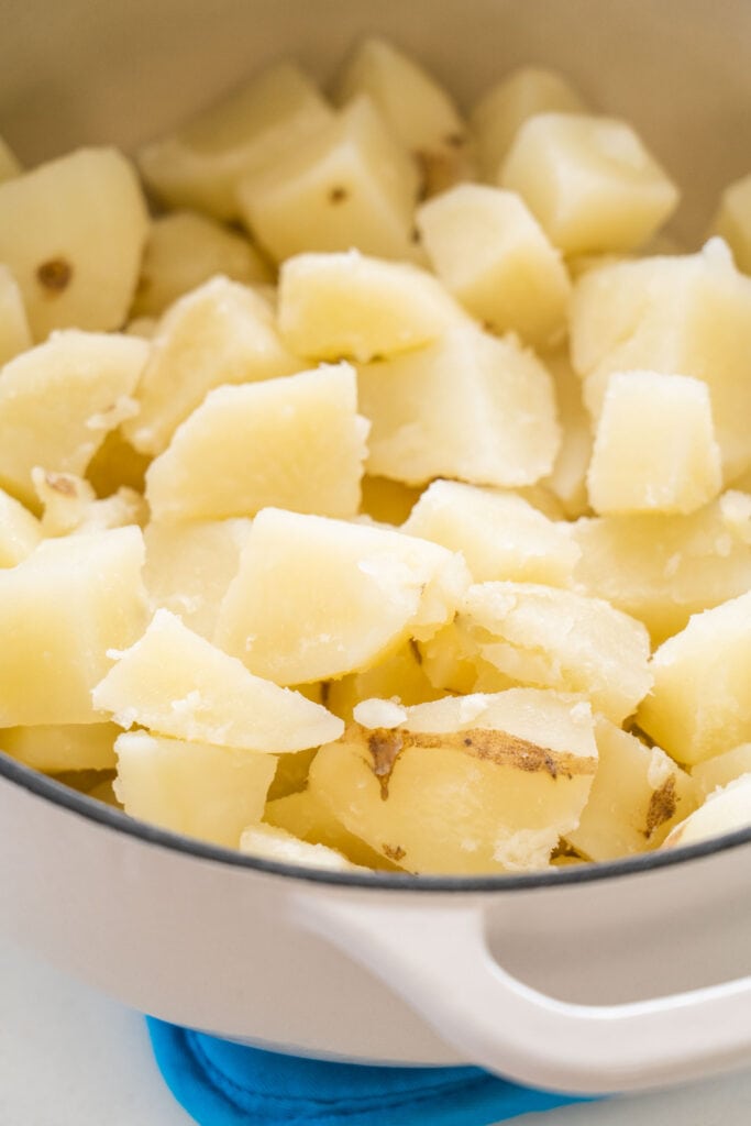 softened potatoes in pot.