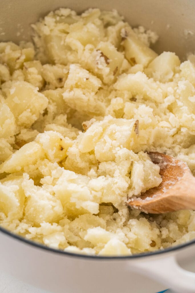 potatoes that have been mashed with a spoon.