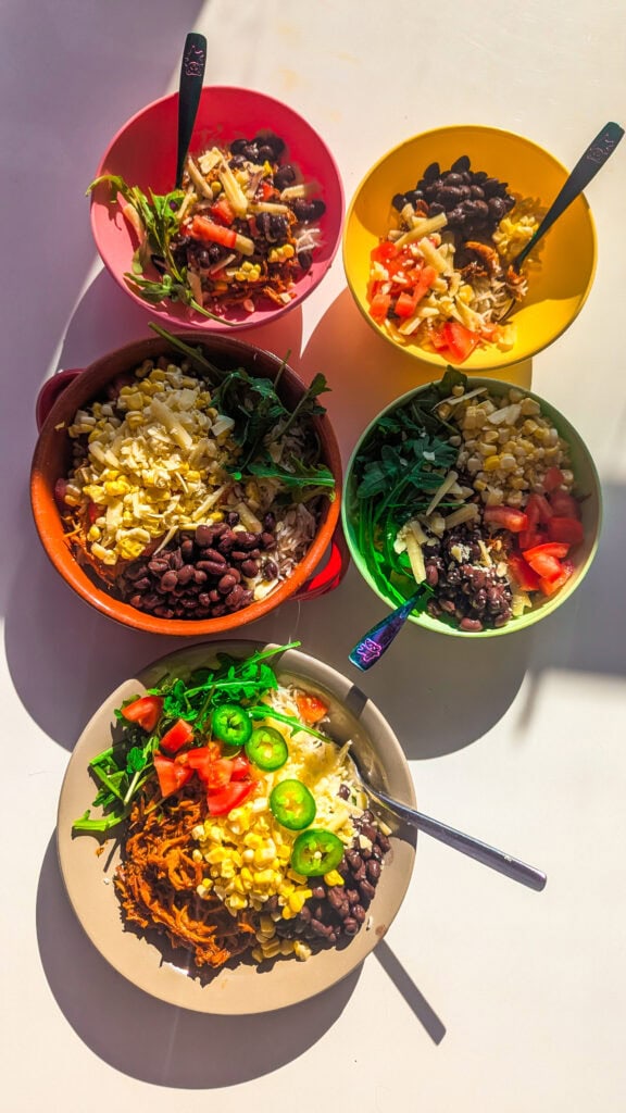 shredded chicken bbq bowls on table. 