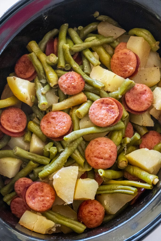 kielbasa, green beans and potatoes cooked in the crockpot.