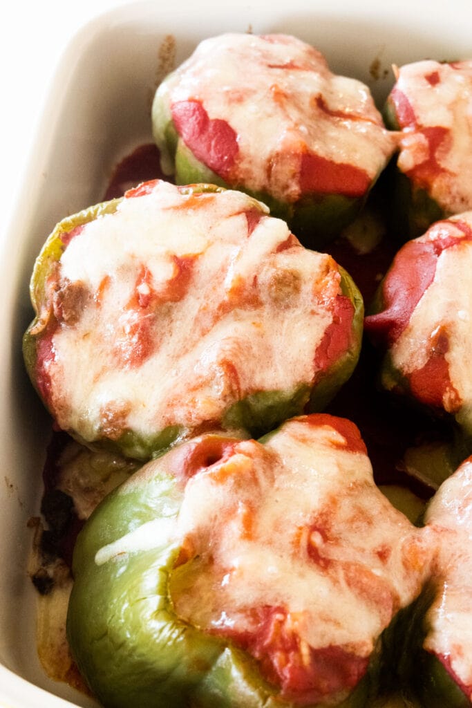 closeup of stuffed pepper with melted cheese on top.