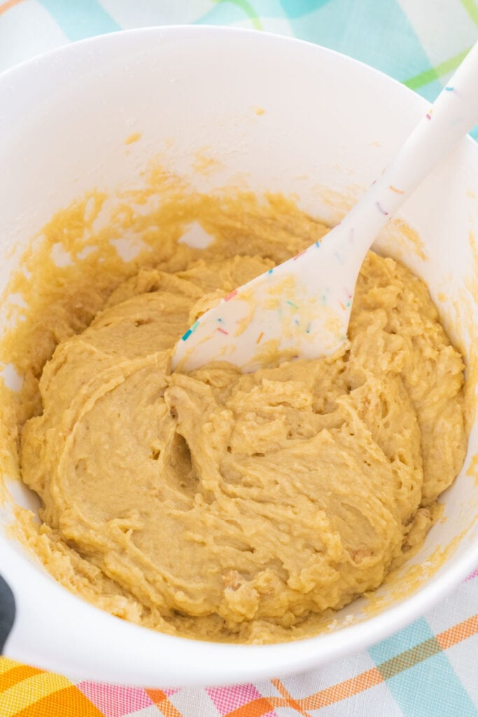 muffin batter in bowl with spoon.