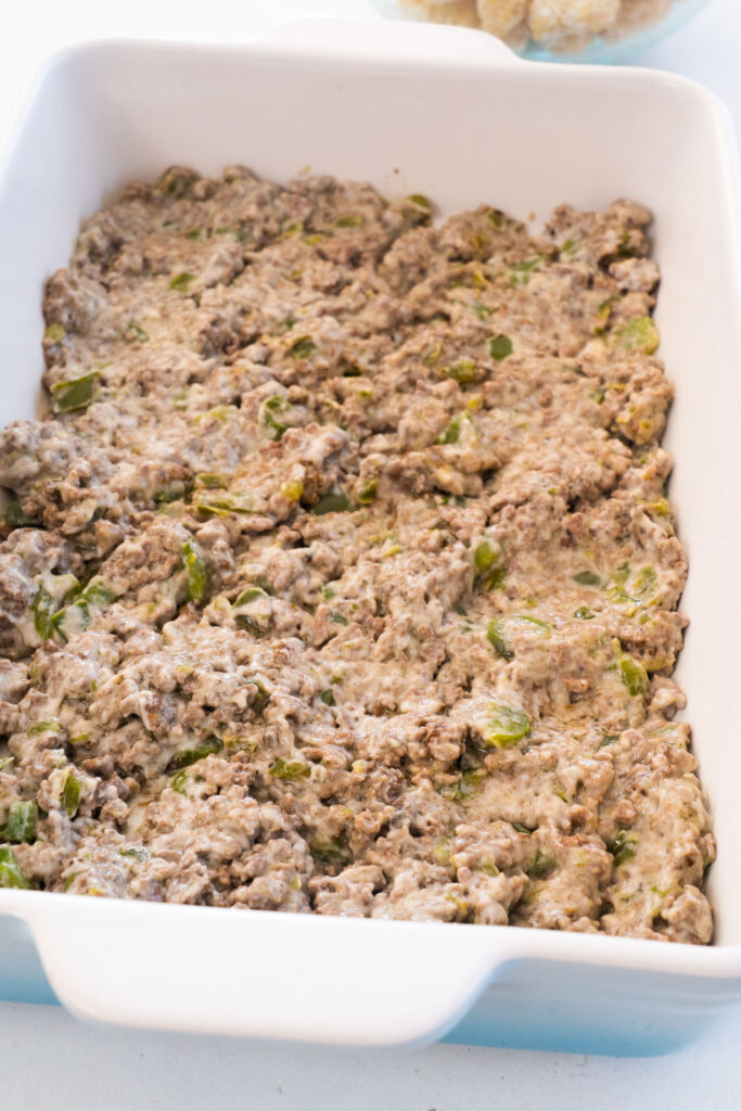 ground beef mixture spread in the bottom of casserole dish.