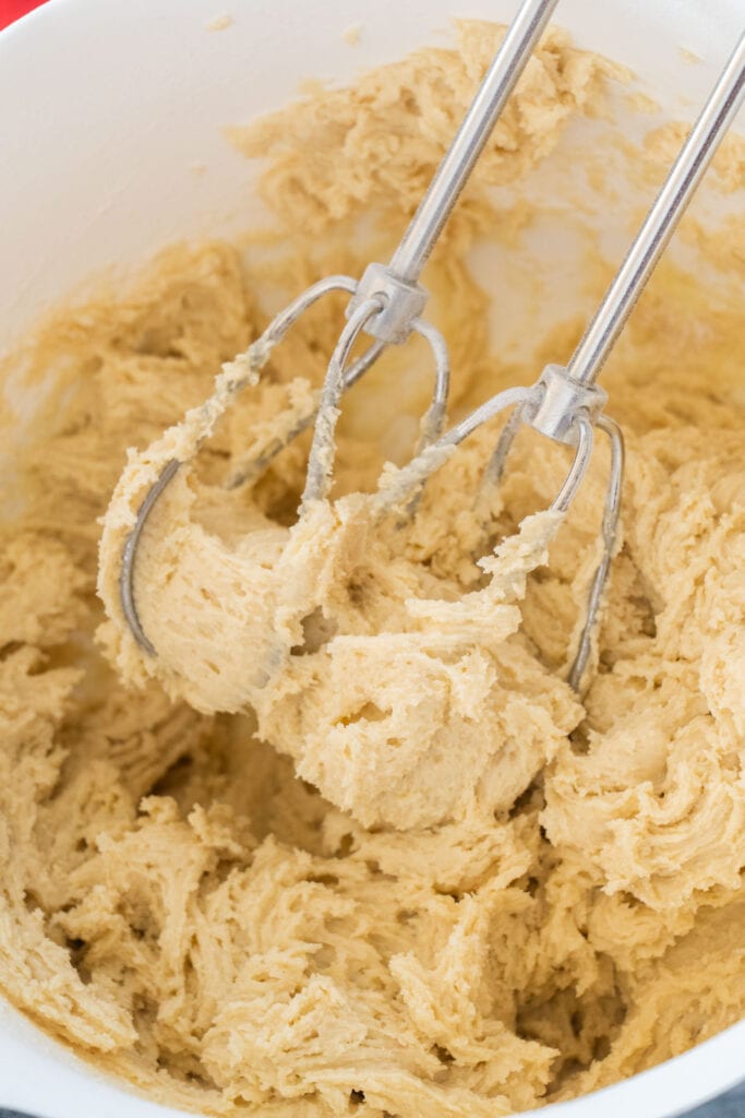 cookie dough with mixer beater in it.