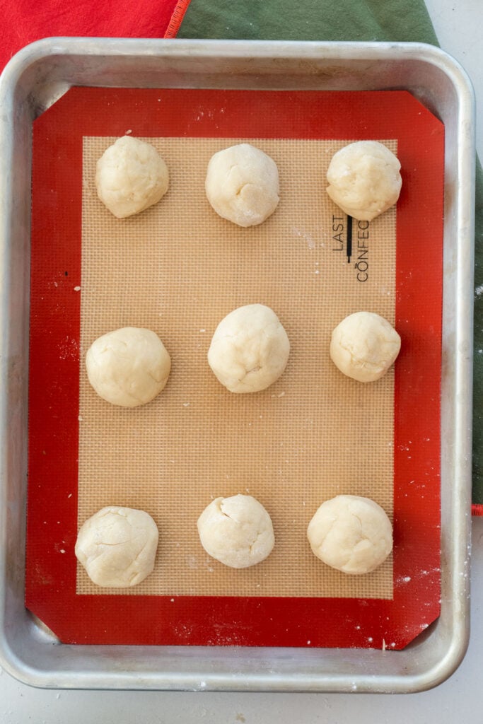 dough balls on cookie sheet.