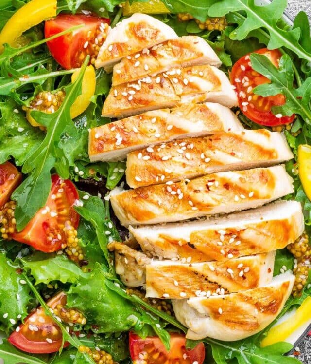 Chicken salad. Meat salad with fresh tomato, sweet pepper, arugula and grilled chicken breast. Chicken fillet with fresh vegetable salad