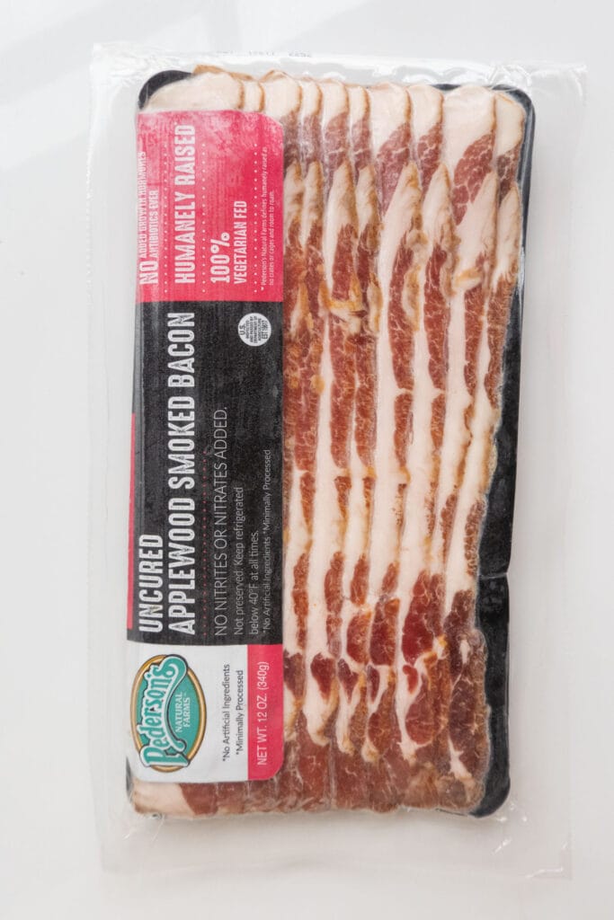 package of applewood smoked bacon on table.