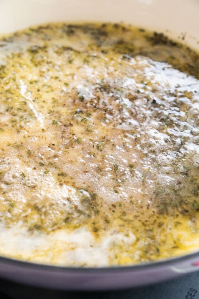 butter sauce boiling in skillet.