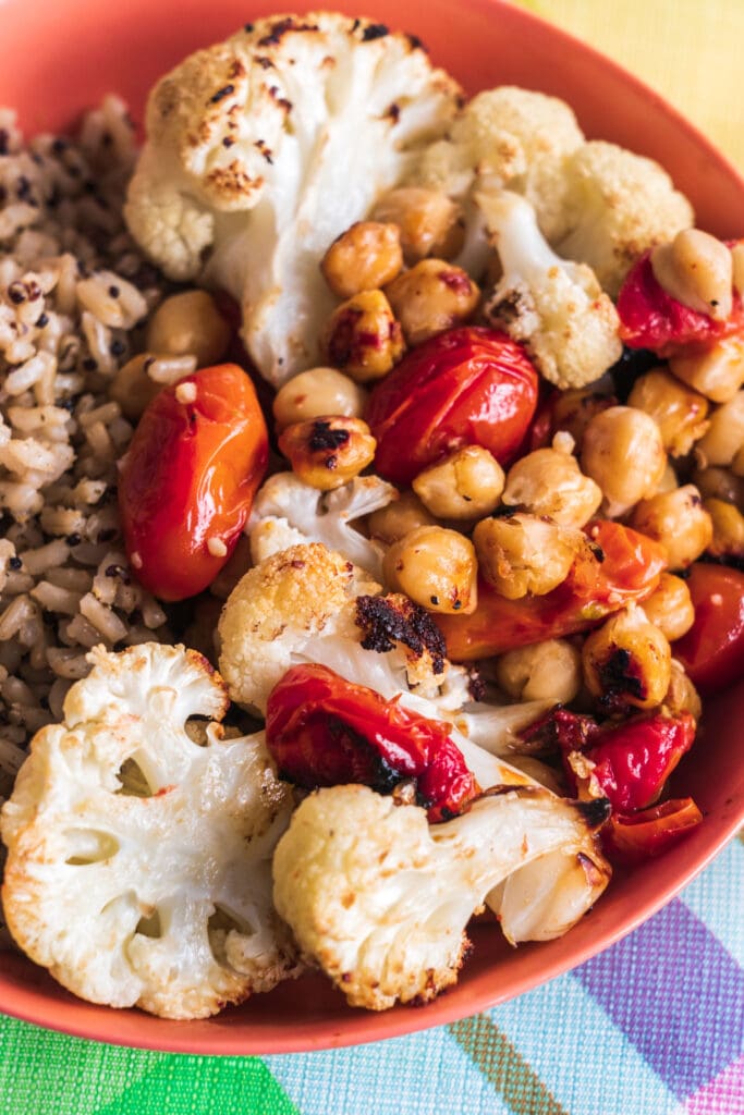 bowl of barley, cauliflower, chickpeas and tomatoes for dinner.