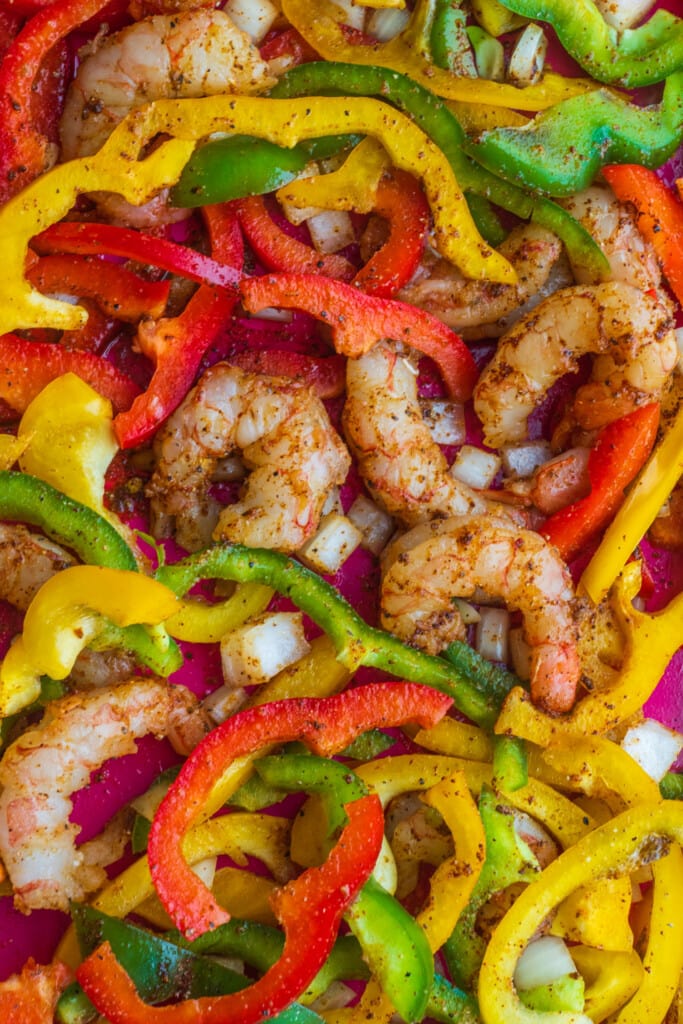 shrimp, peppers and onions with spices on them.