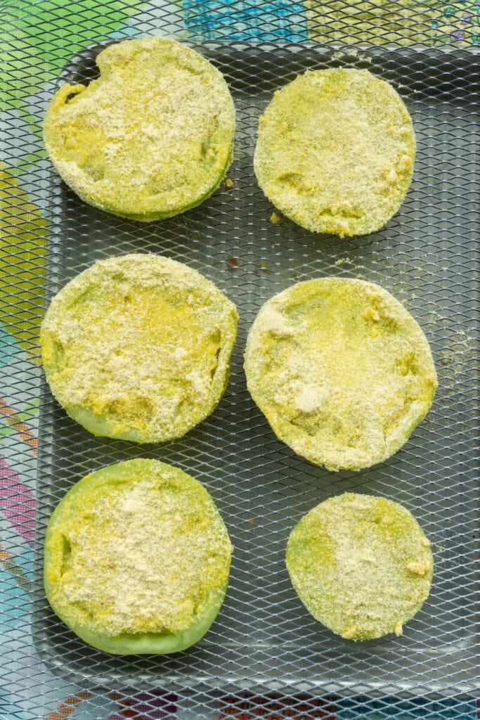 green tomatoes coated in cornmeal.
