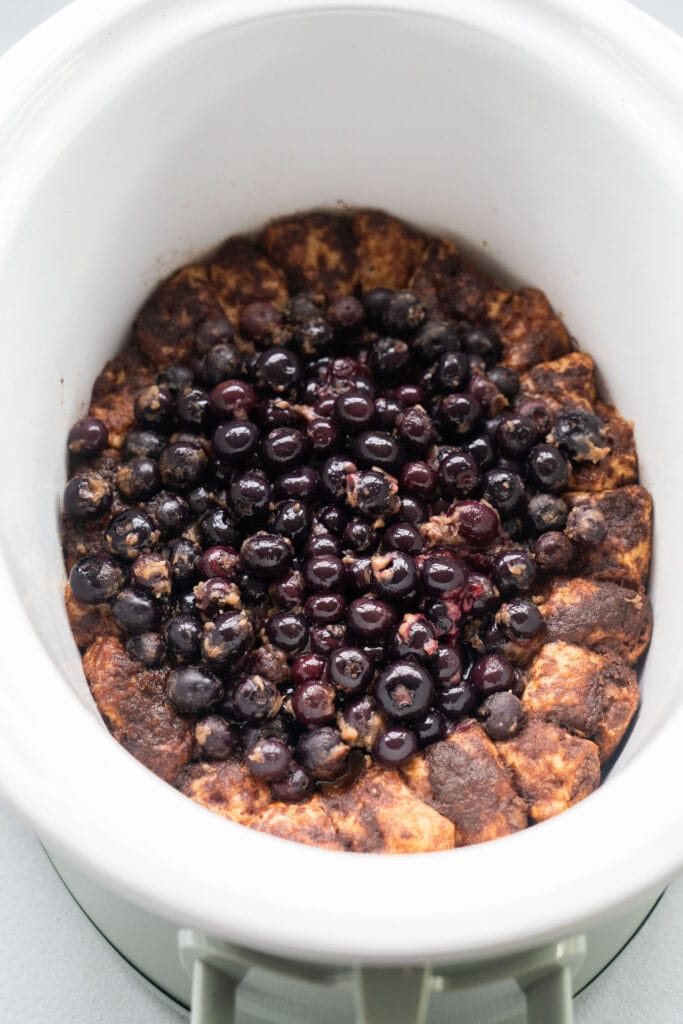cooked blueberry cobbler in slow cooker.