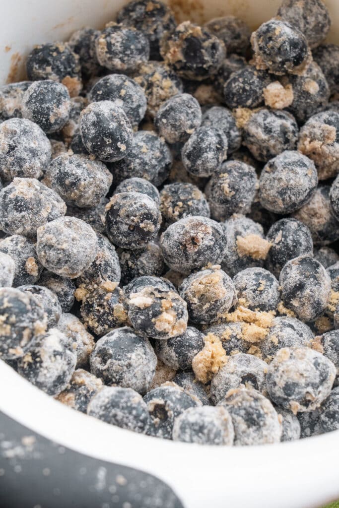 blueberries coated in flour sugar mixture.