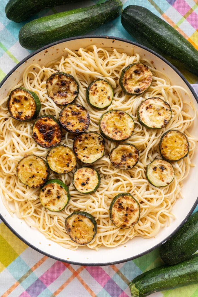 zucchini pasta ready to be served in skillet on table.
