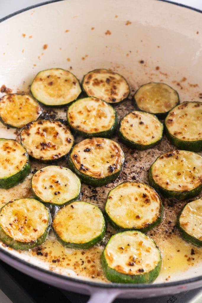 browned zucchini slices in skillet.