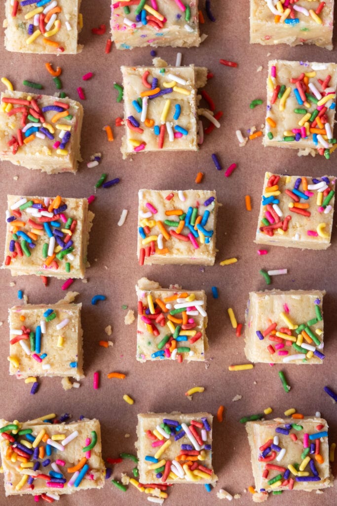 top down view of cake truffle squares with sprinkles.