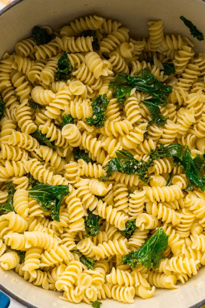 pot filled with kale pasta ready to be served.
