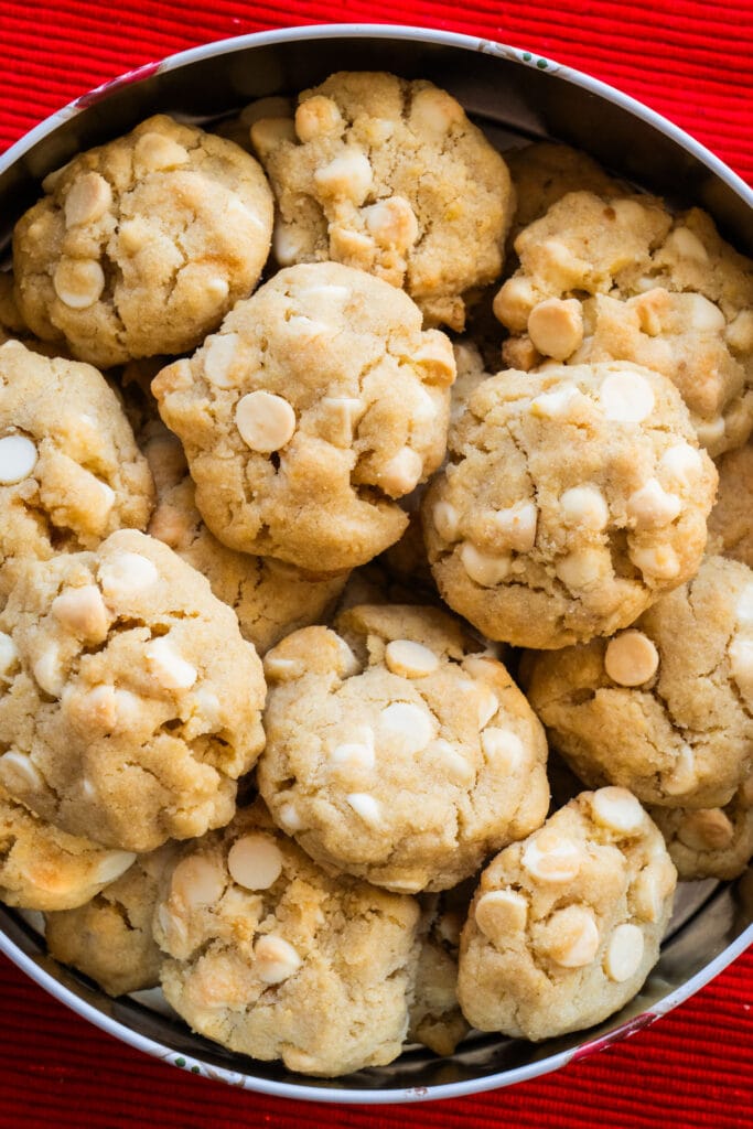 white chocolate chip cookies in cookie tin.