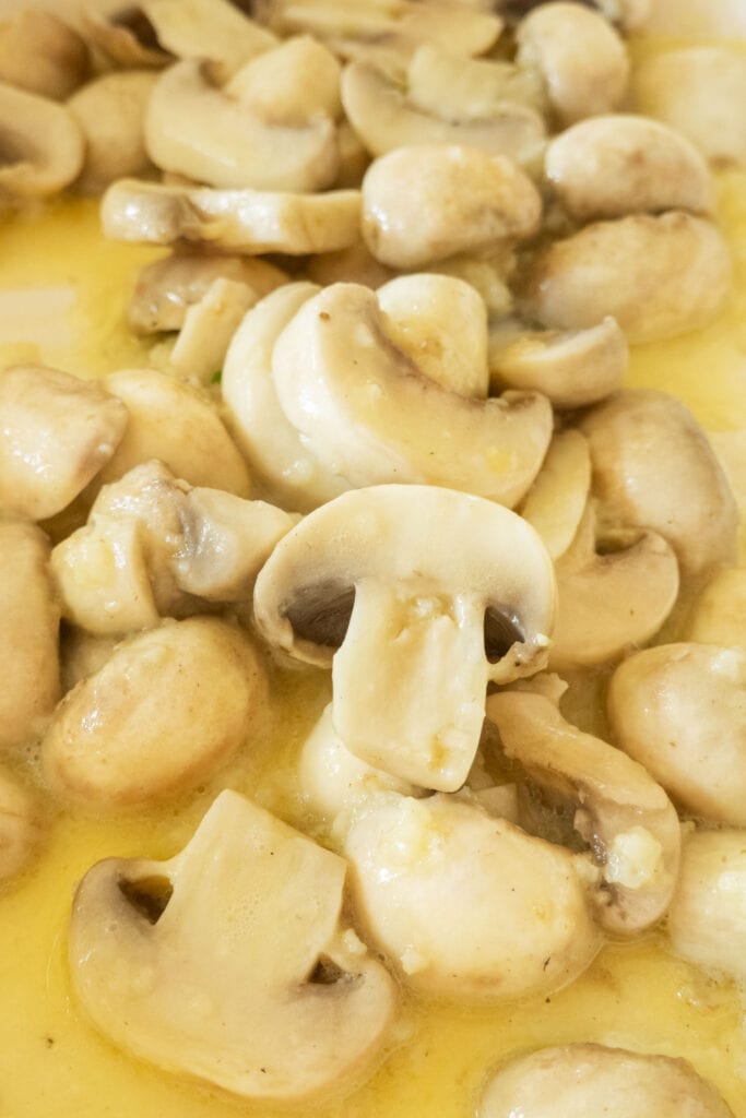 buttery mushrooms in skillet.