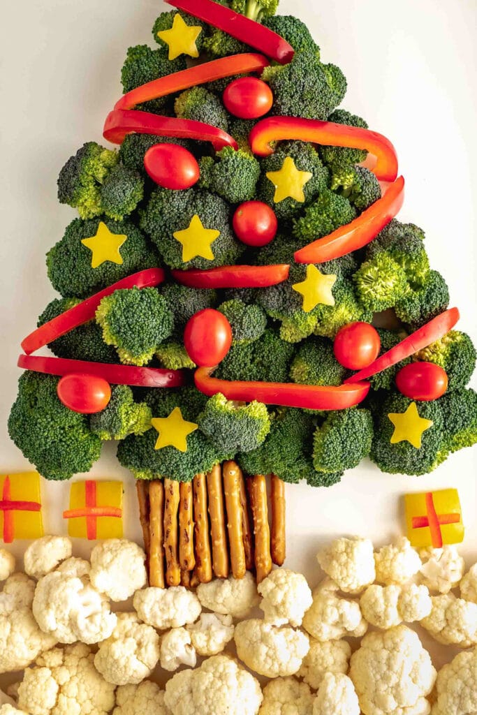 closeup of broccoli tree with peppers and tomatoes.