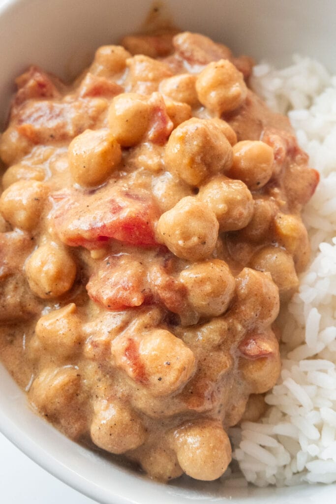 chickpea curry with tomatoes served over rice.