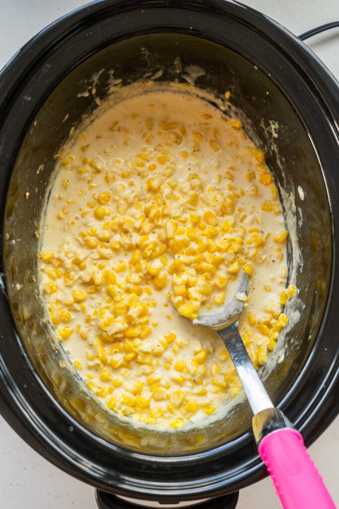 top down view of creamed corn in crockpot.