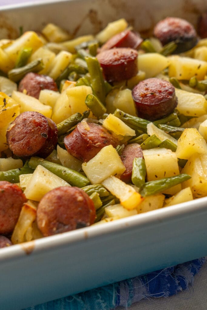 baked casserole with tender potatoes in blue baking dish.