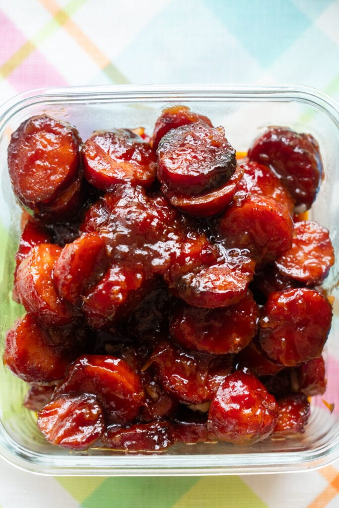 candied kielbasa in freezer safe glass container.