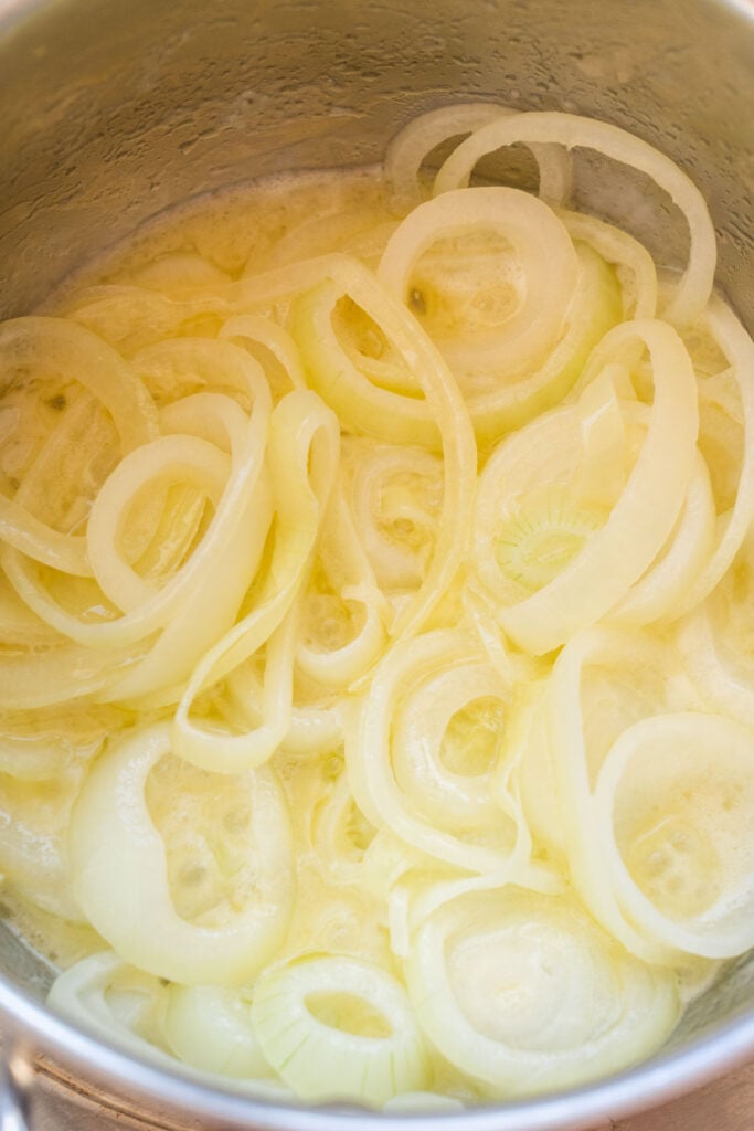 melted butter with onions in saucepan.