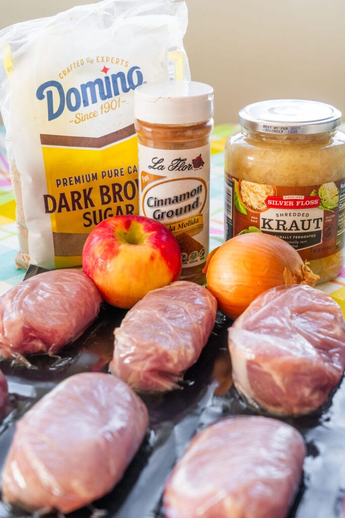 ingredients to make pork chops and sauerkraut on tale. 